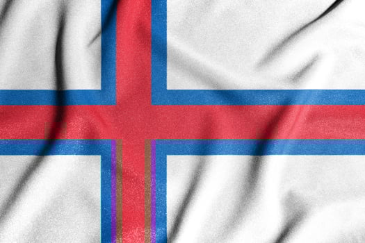 National flag of the Faroe Islands. The main symbol of an independent country. Flag of Faroe Islands. An attribute of the large size of a democratic state. photo