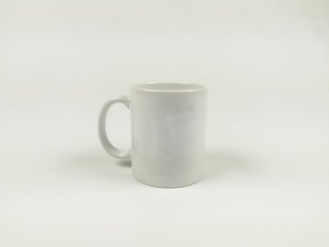 mock up mug. Template of a white mug on the white background photo