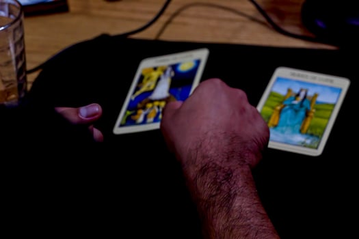 young man reading tarot cards in a meeting with his friends, mexico latin america, 4k photo