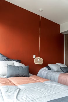 Hotel airbnb room with freshly made king sized bed with headboard, perfectly clean and ironed sheets photo