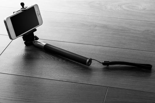 Smart phone and selfie stick photo