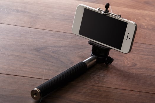 Smart phone and selfie stick photo