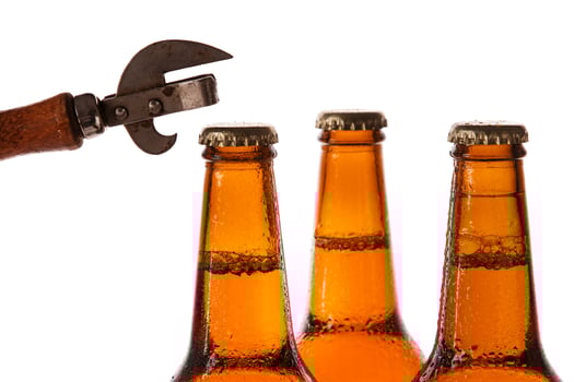 Bottles with beer and vintage opener photo