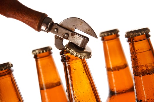 Bottles with beer and vintage opener photo