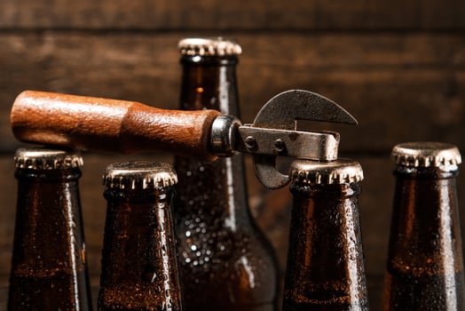 Bottles with beer and vintage opener photo