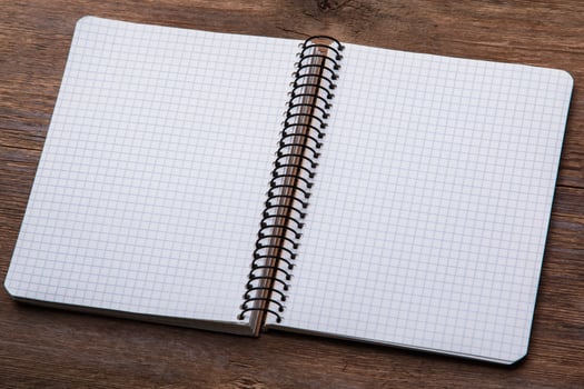 Notepad on wooden surface photo