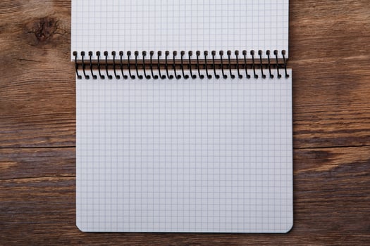 Notepad on wooden surface photo