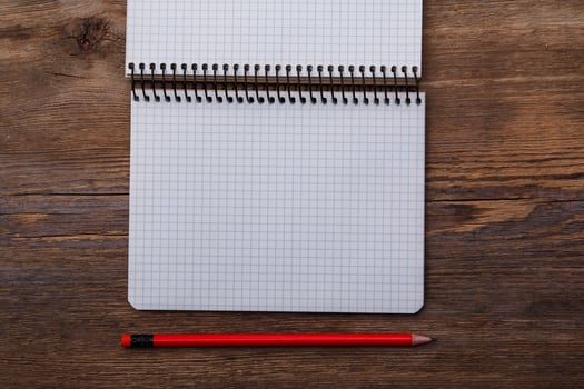 Notepad on wooden surface photo