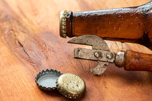 Vintage opener and beer photo