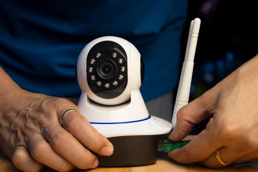 Conceptual man operating ip camera photo