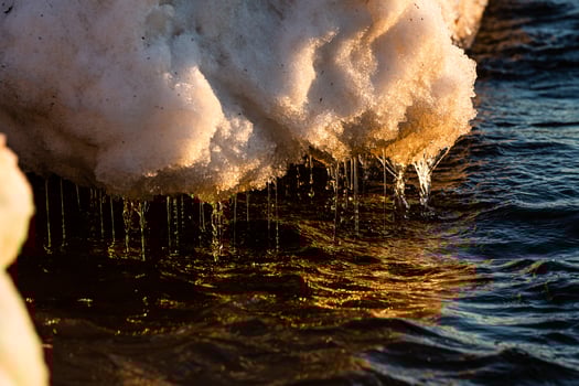 Baltic Sea Coast With Pebbles And Ice at Sunset photo