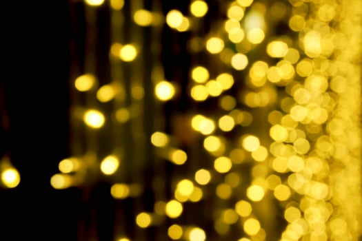 Blurred and bokeh of Christmas lights on black background. photo