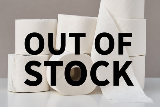 Stacked toilet paper rolls on a gray background. Hygiene concept photo