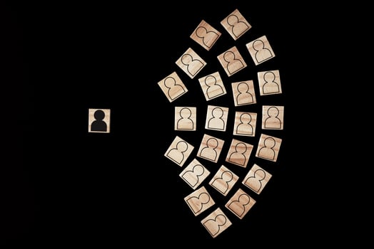 Wooden block with a white people figures and one with black man photo
