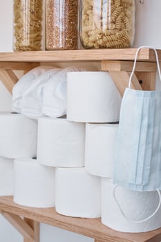 Stocks of toilet paper rolls on shelf photo
