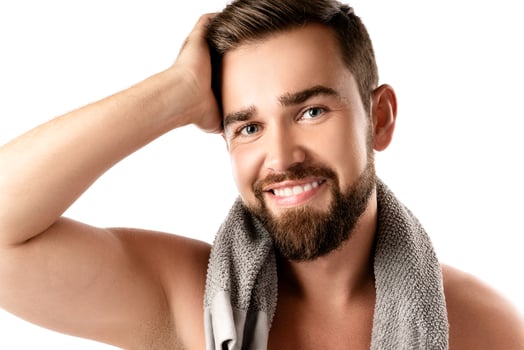Young and handsome bearded man with smooth skin photo