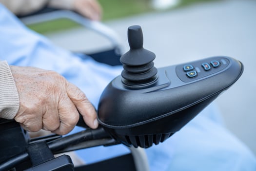 Asian senior or elderly old lady woman patient on electric wheelchair with remote control at nursing hospital ward, healthy strong medical concept photo