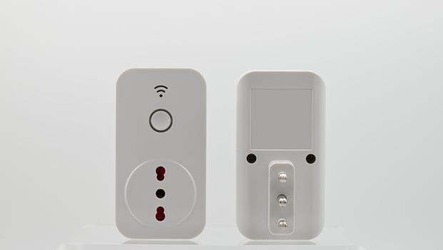 Smart wi-fi plug with energy monitor isolated on white background. photo