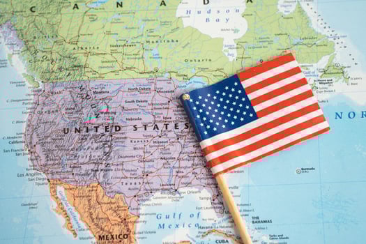Bangkok, Thailand - February 1, 2022 USA America flag on world map background. photo