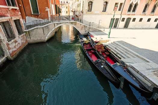 Canal with two gondolas in Venice, Italy. photo
