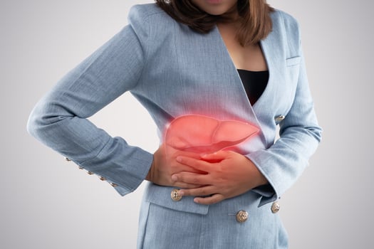 The photo of liver on woman's body against gray background, Hepatitis, Concept with healthcare and medicine.