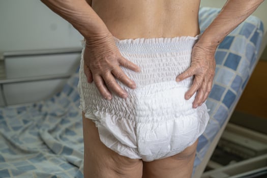 Asian senior or elderly old lady woman patient wearing incontinence diaper in nursing hospital ward, healthy strong medical concept. photo
