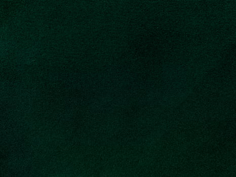 Dark green old velvet fabric texture used as background. Empty green fabric background of soft and smooth textile material. There is space for text. photo