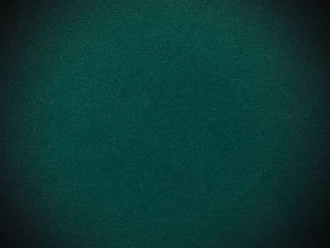 Dark green old velvet fabric texture used as background. Empty green fabric background of soft and smooth textile material. There is space for text.. photo