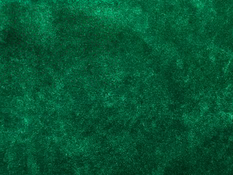 Dark green old velvet fabric texture used as background. Empty green fabric background of soft and smooth textile material. There is space for text... photo