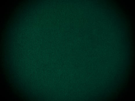 Dark green old velvet fabric texture used as background. Empty green fabric background of soft and smooth textile material. There is space for text... photo