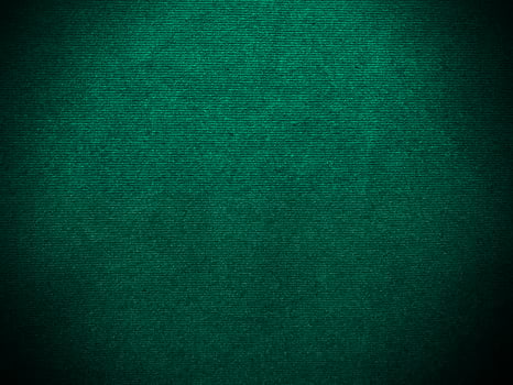 Dark green old velvet fabric texture used as background. Empty green fabric background of soft and smooth textile material. There is space for text.. photo