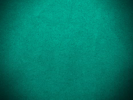 Dark green old velvet fabric texture used as background. Empty green fabric background of soft and smooth textile material. There is space for text.. photo