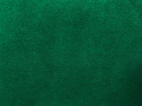 Dark green old velvet fabric texture used as background. Empty green fabric background of soft and smooth textile material. There is space for text.. photo