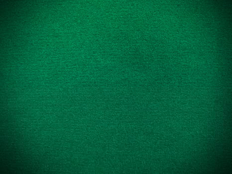 Dark green velvet fabric texture used as background. Empty green fabric background of soft and smooth textile material. There is space for text. photo