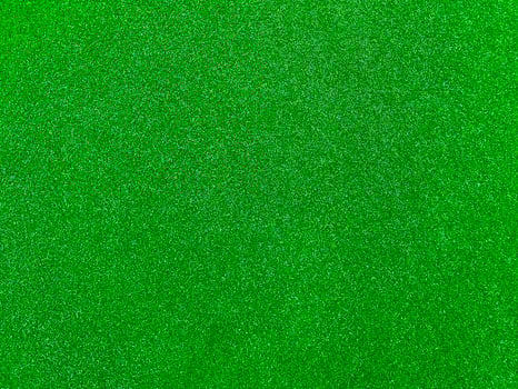 Green grass texture background grass garden top view. Concept used for making green background football pitch, Grass Golf,  green lawn pattern textured background. photo