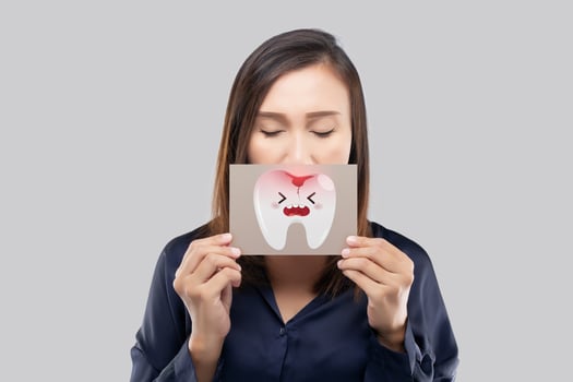 Asian woman decayed tooth photo