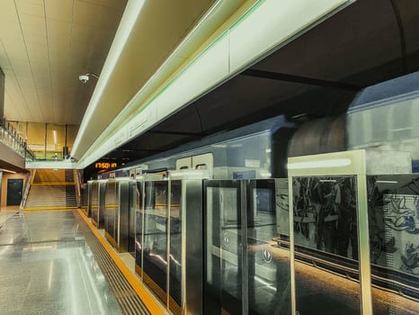 Platform sliding doors are a system used at subway stations that isolates passengers from railway tracks for the safety of passengers. The doors open after the train arrives at the station photo