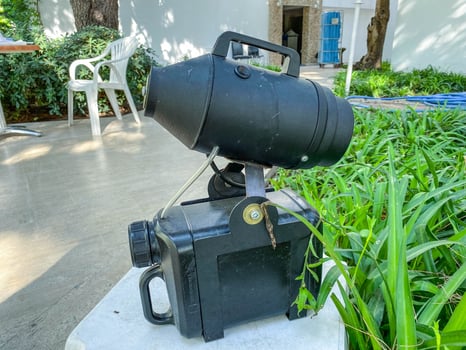 fog generator. a device for spraying antiseptic on the suitcases of tourists arriving at the hotel. coronavirus measures, restricting visitors from infection photo