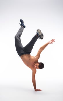 Cool young break dancer performing in studio on white background. photo