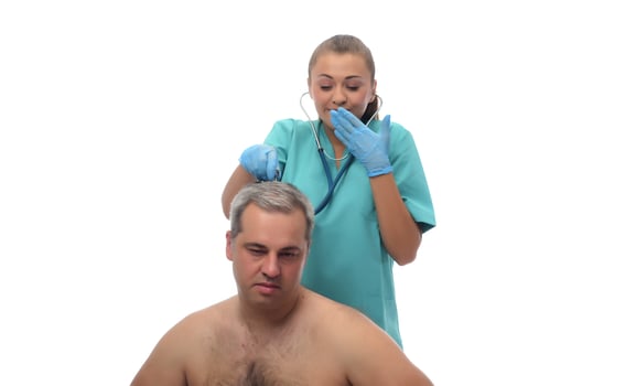 Female Doctor checking on patient with stethoscope. photo