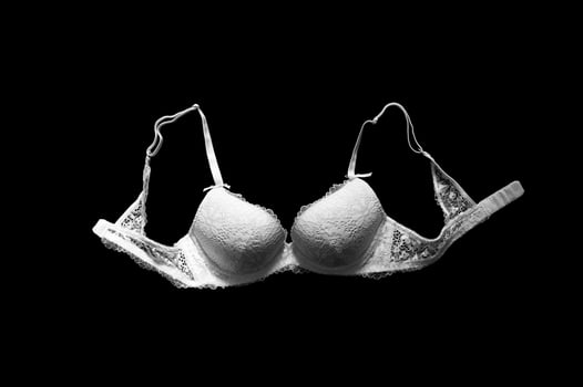 Lingerie white, removed from the top on a black background photo
