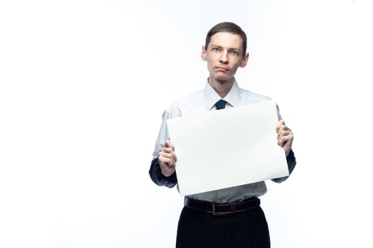 Business man with a piece of paper in his hands on a white, isolated background photo