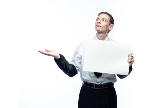 Business man with a piece of paper in his hands on a white, isolated background photo