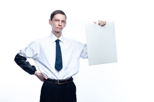Business man with a piece of paper in his hands on a white, isolated background photo