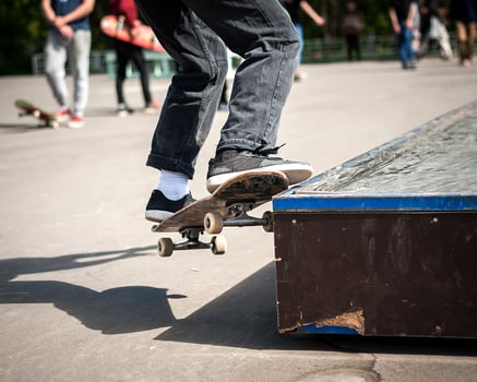 skateboarder does the trick with a jump on the ramp. Skateboarder flying in the air photo