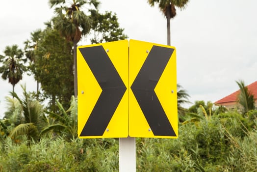Traffic signs Be careful of roads and curves. Drive slowly and be careful of the curves ahead on rural highways and beautiful blue skies. photo