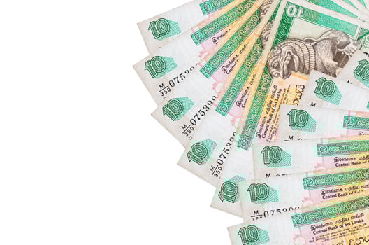 10 Sri Lankan rupees bills lies isolated on white background with copy space. Rich life conceptual background photo