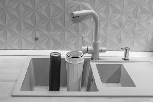 water filter cartridge for home on background kitchen photo
