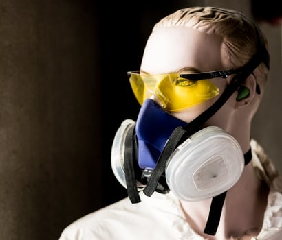 Safety mannequin modeling glasses and respirator mask photo