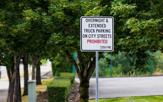 No overnight parking prohibited sign with fine photo